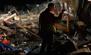 US tornado: An emergency worker searches a Walmart store in Joplin, Missouri