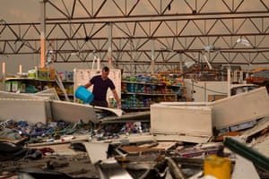 US tornado: A man stands amid the remains of a Wal-Mart store, in Joplin, Missouri