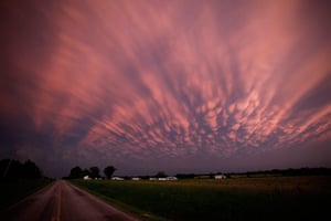 US tornado: Storm clouds dwarf a farm near Lamar, Missouri