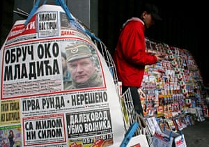 Ratko Mladic: A newspaper vendor counts money next to a newspaper