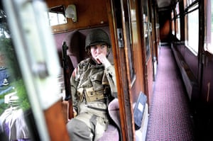1940s re-enactment: A young enthusiast dressed as a soldier rides on the train
