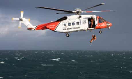 Coastguard helicopter over sea