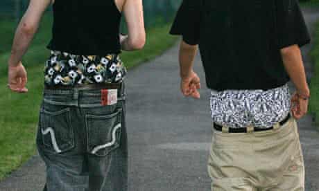 Young men in sagging trousers.