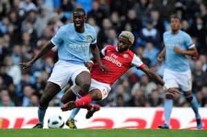 Top 50 transfer targets: Manchester City's Yaya Toure is tackled by Arsenal's Alex Song