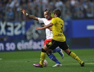 Top 50 transfer targets:  Eljero Elia of Hamburg is challenged by Mario Goetze of Borussia Dortmund 