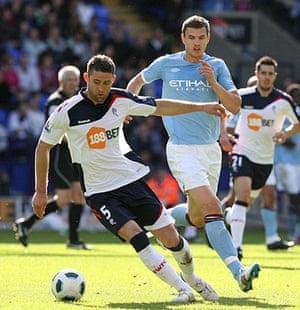 Top 50 transfer targets: Bolton's Gary Cahill takes the ball away from Manchester City's Edin Dzeko