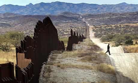 A US Border Patrol agent near the fence along Arizona's border with Mexico