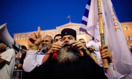 Greek Orthodox monk speaks to protesters