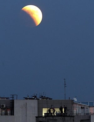 Lunar Eclipse: A lunar eclipse from a rooftop in Belgrade