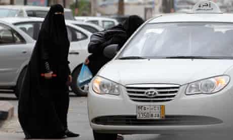 Saudi women board a taxi in Riyadh 