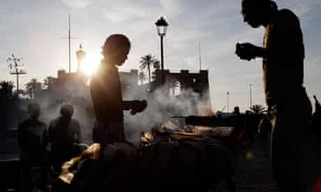 A street vendor sells kebabs in central Tripoli, Libya
