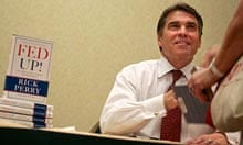 Rick Perry signs copies of his book for supporters