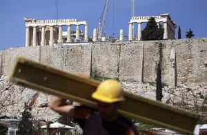 Greece:  A labourer works on the roof of the new Acropolis museum in Athens