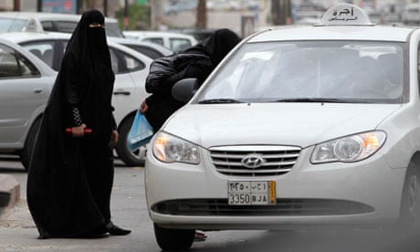 Saudi women hail a taxi in Riyadh