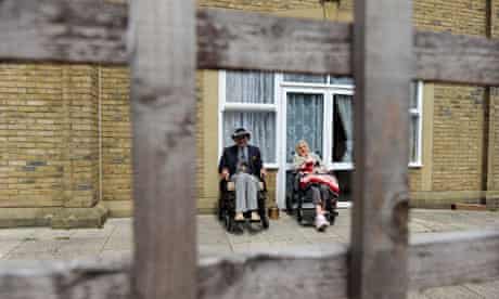 Residents sit outside a Southern Cross care home in Camberwell Green in south London