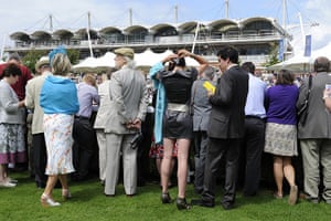 Glorious Goodwood Wed: Punters gather around the parade ring