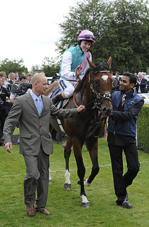 Glorious Goodwood: Tom Queally pats Frankel as they enter the winner's enclosure