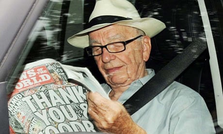 Rupert Murdoch reading the last edition of the News of the World