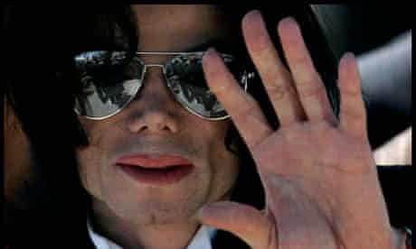 Michael Jackson waves as he leaves the Santa Barbara County Courthouse