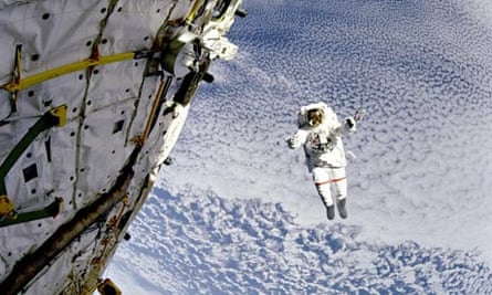 Astronaut Mark Lee floats outside Discovery, 149 miles above the Earth, 1994. 