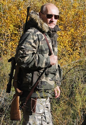 Vladimir Putin: carrying a hunting rifle