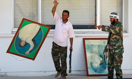 Rebel fighters with posters of Muammar Gaddafi, 18 August 2011