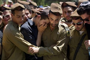 Israeli air strikes: Israeli soldiers mourn during the funeral of First Sgt. Moshe Naftali