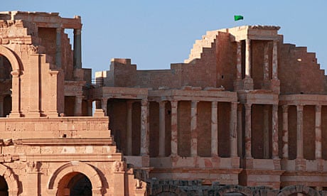 A Libyan national flag flies over the ruins of a theatre in Sabratha