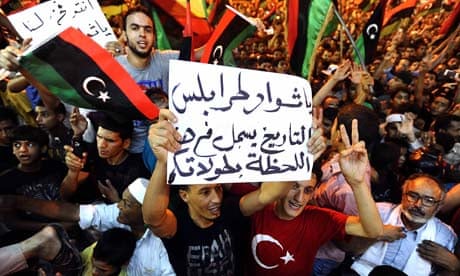 Libyans celebrate the capture in Tripoli of Muammar Gaddafi's son Saif al-Islam