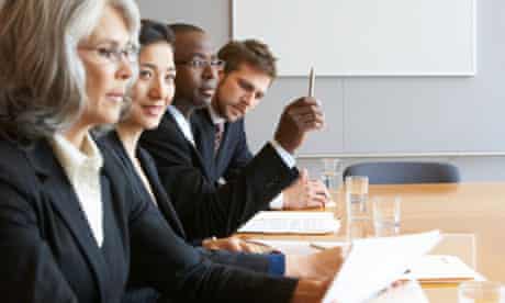 Men and women in a boardroom
