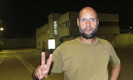 Saif al-Islam Gaddafi waves victory sign 
