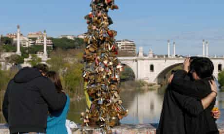 Lovers hang padlocks on Rome's Ponte Milvio.