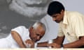 Anna Hazare is given a drink on the 11th day of his fast in New Delhi