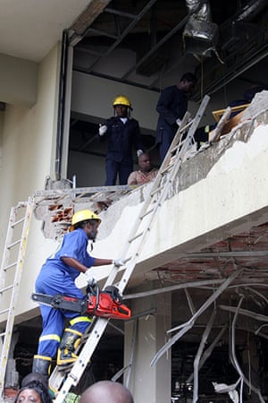 UN Abuja bomb blast: Rescuers at climb into the building