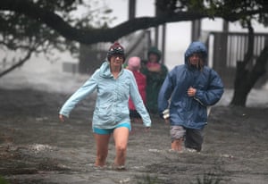 Hurricane Irene: Residents wade through floodwater in Kill Devil Hills, North Carolina