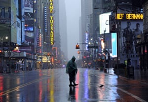 Hurricane Irene update: A man walks across 42nd Street in Times Square as Hurricane Irene hits