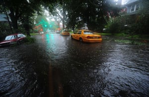 Hurricane Irene update: A taxi stands in flood water as Hurricane Irene hits in Brooklyn