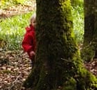 Child hiding in a wood