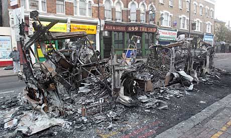 In Tottenham, rioters set fire to buildings and vehicles, including this double-decker bus