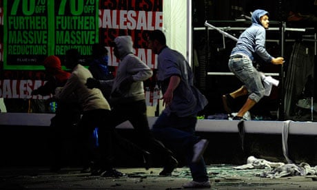 UK riots: Looters run from a clothing store in Peckham, London