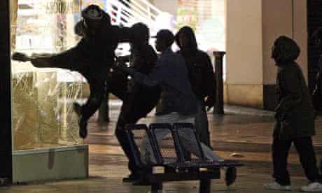 People attack a jewellers shop near the Bullring shopping centre in Birmingham, on August 8 2011