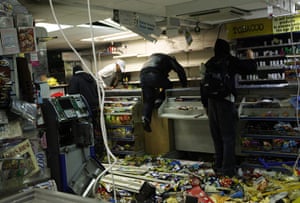 London Riots: Looters rampage through a convenience store in Hackney