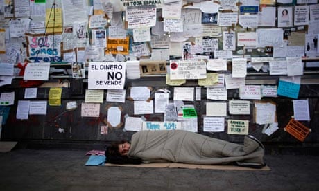 A demonstrator sleeps at Madrid's Puerta del Sol