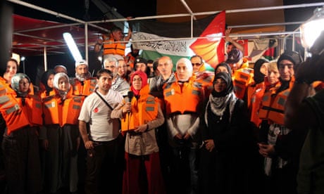 Pro-Palestinian activists hold a news conference on board the Turkish ship Mavi Marmara