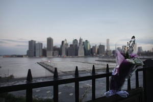 9/11 anniversary: A bouquet of flowers is tied to a railing overlooking  Manhattan 