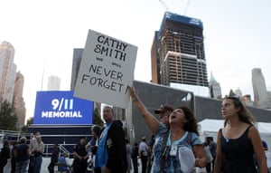 9/11 anniversary: Elba Cedeno holds a sign memorializing her partner, Catherine Theresa Smith