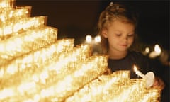 Girl lighting a candle