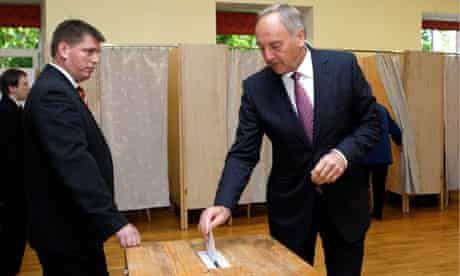 Latvia's President Berzins casts his vote during the snap parliament elections in Riga