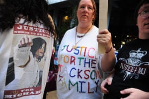 Michael Jackson trial: Michael Jackson supporters hold signs outside Los Angeles Superior Court