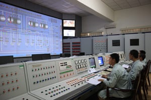 China space launch: Technicians work to inject oxdizer for the Long March-II F carrier rocket